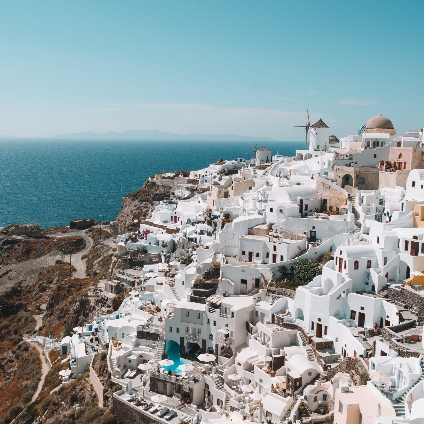 Greek Isles, where white-washed houses meet the azure sea—a captivating destination with Dromo.
