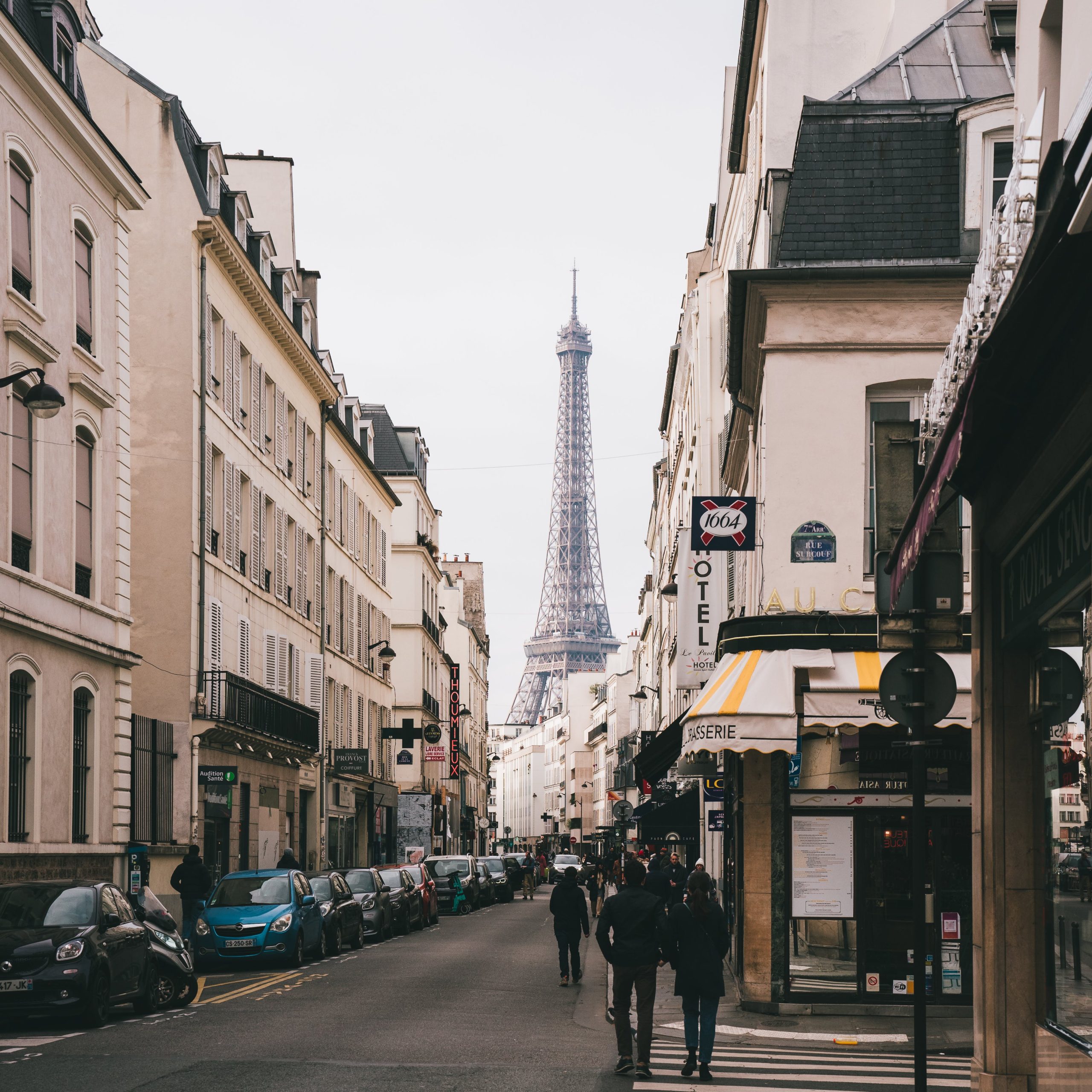 A charming Parisian street with the iconic Eiffel Tower in the background