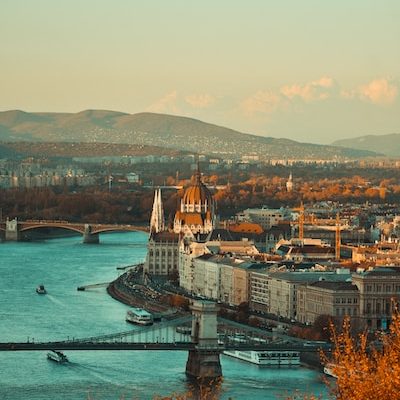 Photo of budapest with a scenic view of the Danube River and historic buildings.